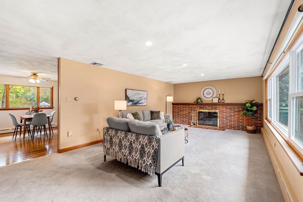 Dining room, Fireplace, Interior, Living room, Recessed Lighting, Stone Walls, Wood Texture Flooring