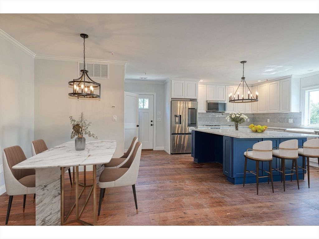 Chandelier, Dining room, Interior, Kitchen, Pendant Lights, Stainless Steel Appliances, Wood Texture Flooring