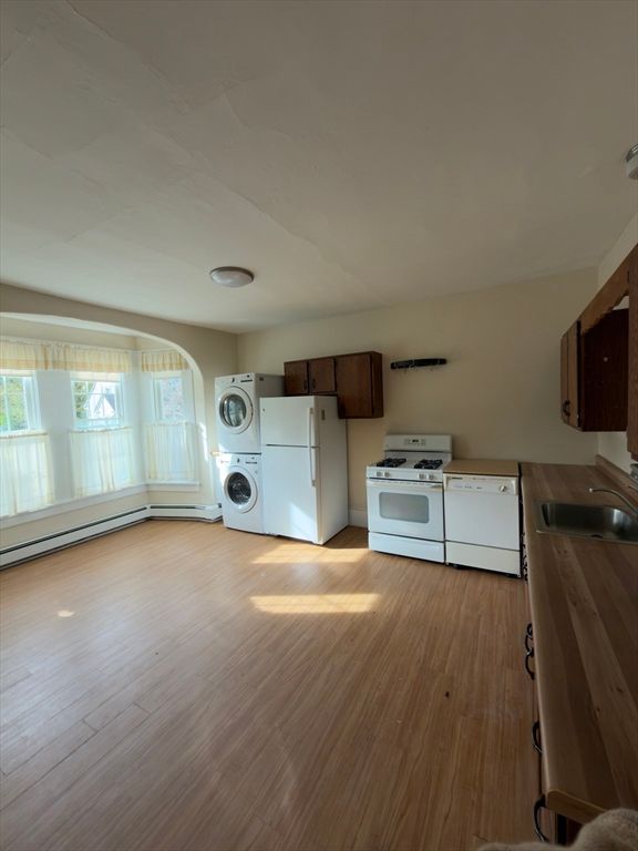 Interior, Kitchen, Recessed Lighting, Washer, Wood Texture Flooring
