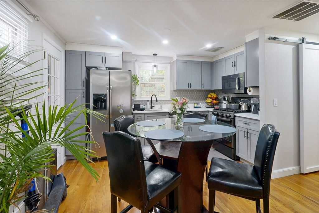 Dining room, Interior, Kitchen, Pendant Lights, Recessed Lighting, Stainless Steel Appliances, Wood Texture Flooring
