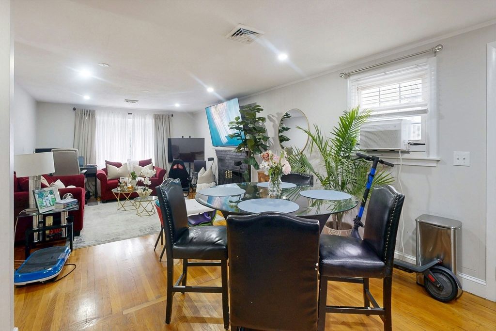 Dining room, Fireplace, Interior, Living room, Recessed Lighting, Wood Texture Flooring