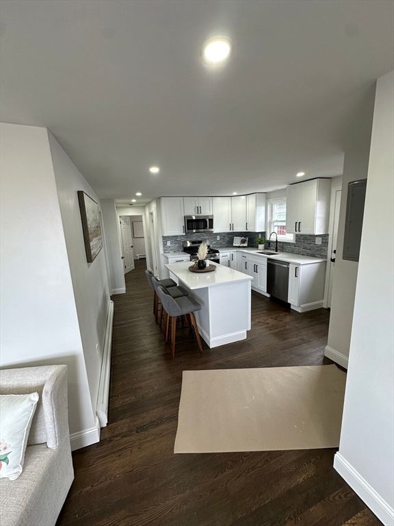 Dining room, Interior, Kitchen, Recessed Lighting, Stainless Steel Appliances, Wood Texture Flooring