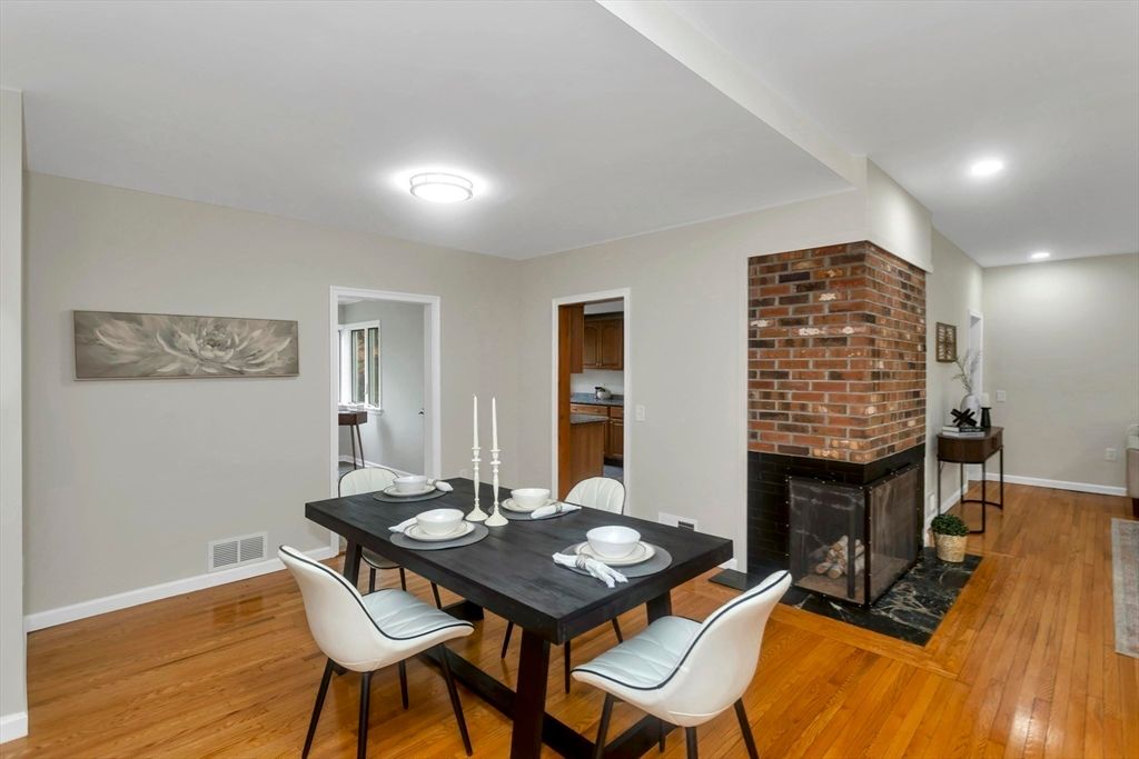 Dining room, Fireplace, Interior, Recessed Lighting, Stone Walls, Wood Texture Flooring