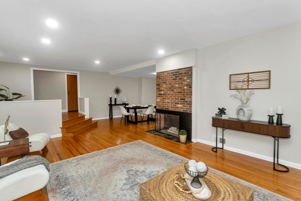 Dining room, Fireplace, Interior, Recessed Lighting, Stone Walls, Wood Texture Flooring