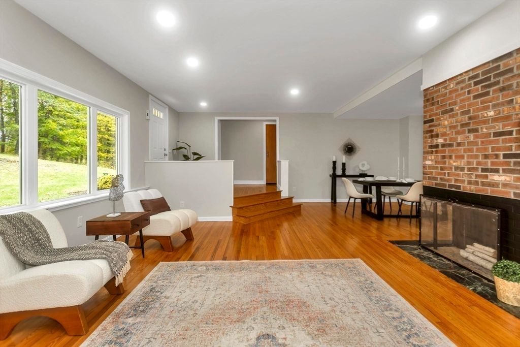 Dining room, Fireplace, Interior, Recessed Lighting, Stone Walls, Wood Texture Flooring