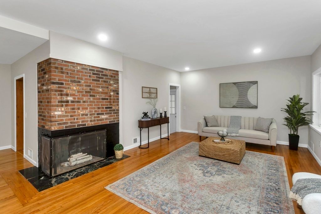 Fireplace, Interior, Living room, Recessed Lighting, Stone Walls, Wood Texture Flooring