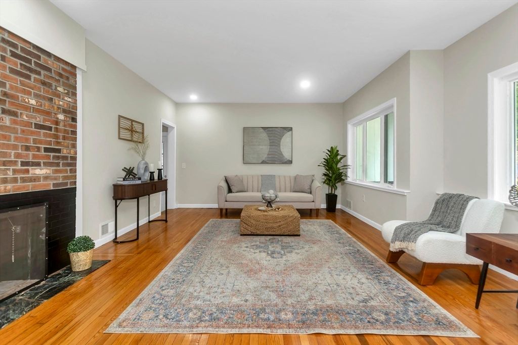 Fireplace, Interior, Living room, Recessed Lighting, Stone Walls, Wood Texture Flooring