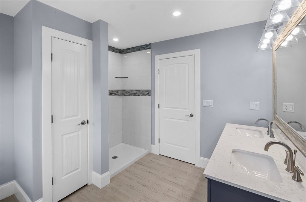 Bathroom, Dual Sink Vanities, Interior, Recessed Lighting, Wood Texture Flooring