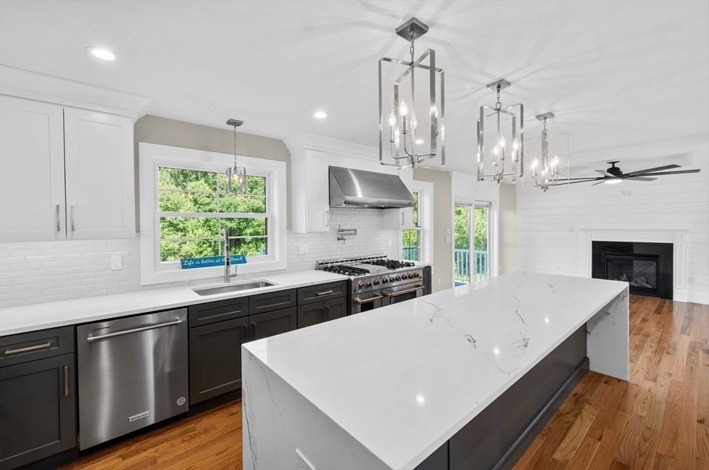 Fireplace, Interior, Kitchen, Pendant Lights, Recessed Lighting, Stainless Steel Appliances, Wood Texture Flooring
