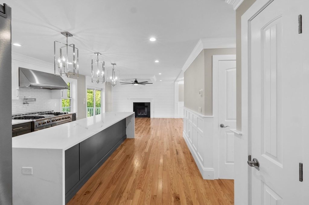 Fireplace, Interior, Kitchen, Pendant Lights, Recessed Lighting, Stainless Steel Appliances, Wood Texture Flooring