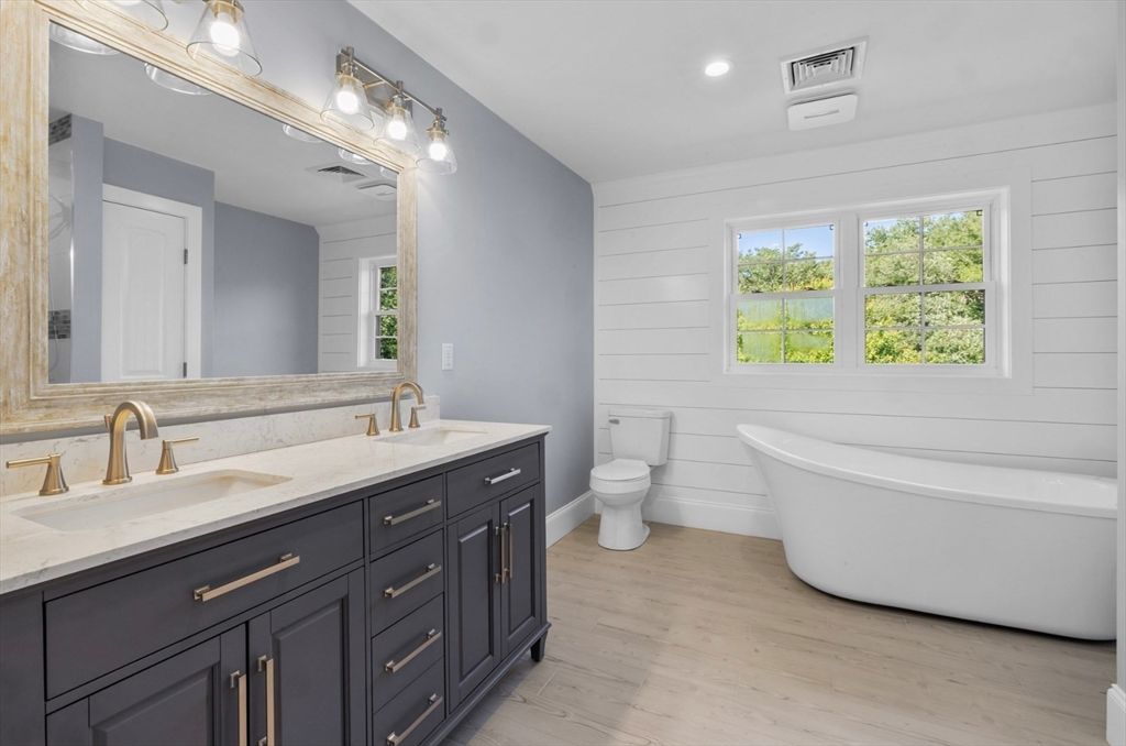 Bathroom, Dual Sink Vanities, Free Standing Baths, Interior, Recessed Lighting, Wood Texture Flooring