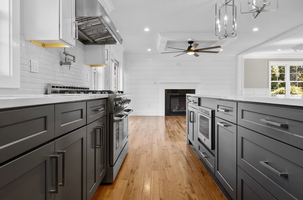 Fireplace, Interior, Kitchen, Pendant Lights, Recessed Lighting, Stainless Steel Appliances, Wood Texture Flooring
