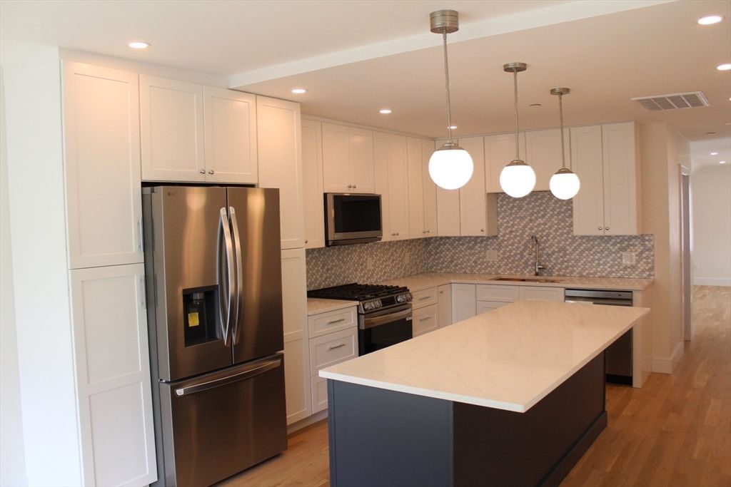 Interior, Kitchen, Pendant Lights, Recessed Lighting, Stainless Steel Appliances, Wood Texture Flooring
