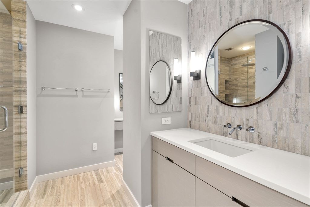 Bathroom, Dual Sink Vanities, Glass Shower, Interior, Recessed Lighting, Wood Texture Flooring