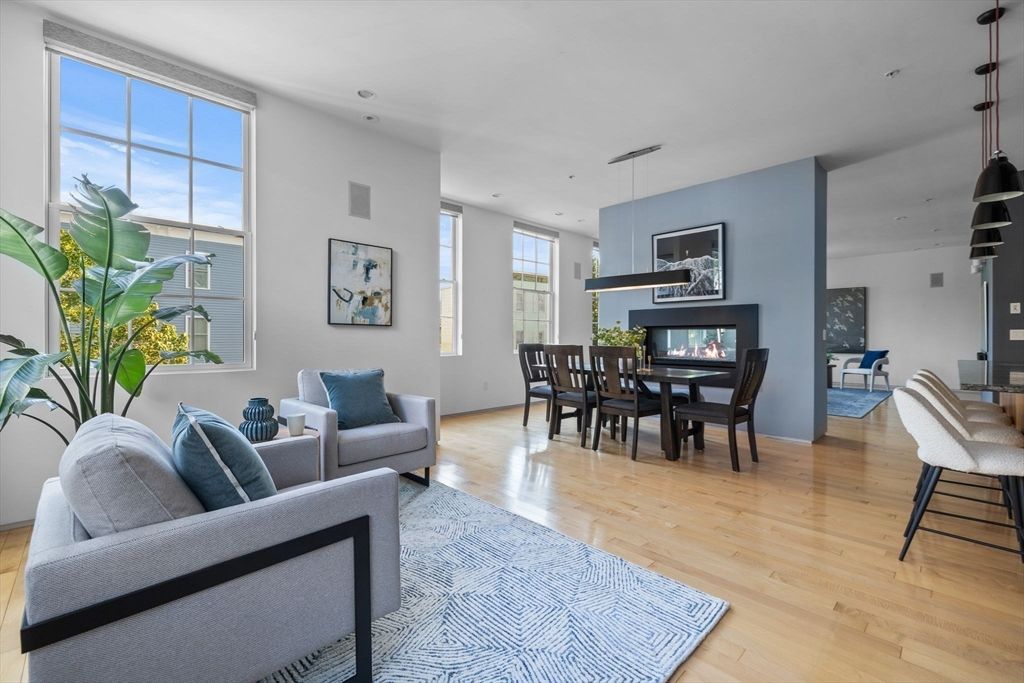Dining room, Fireplace, Interior, Living room, Pendant Lights, Recessed Lighting, Wood Texture Flooring
