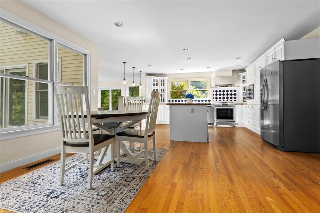 Dining room, Interior, Kitchen, Pendant Lights, Recessed Lighting, Stainless Steel Appliances, Wood Texture Flooring