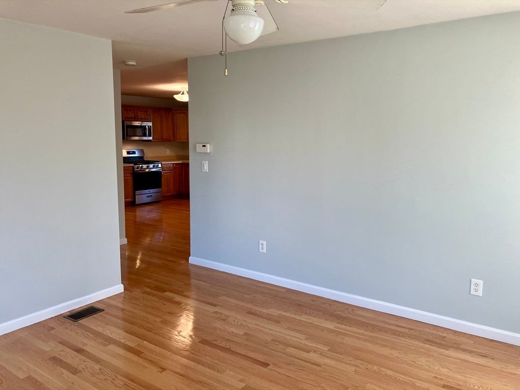 Empty room, Interior, Kitchen, Stainless Steel Appliances, Wood Texture Flooring