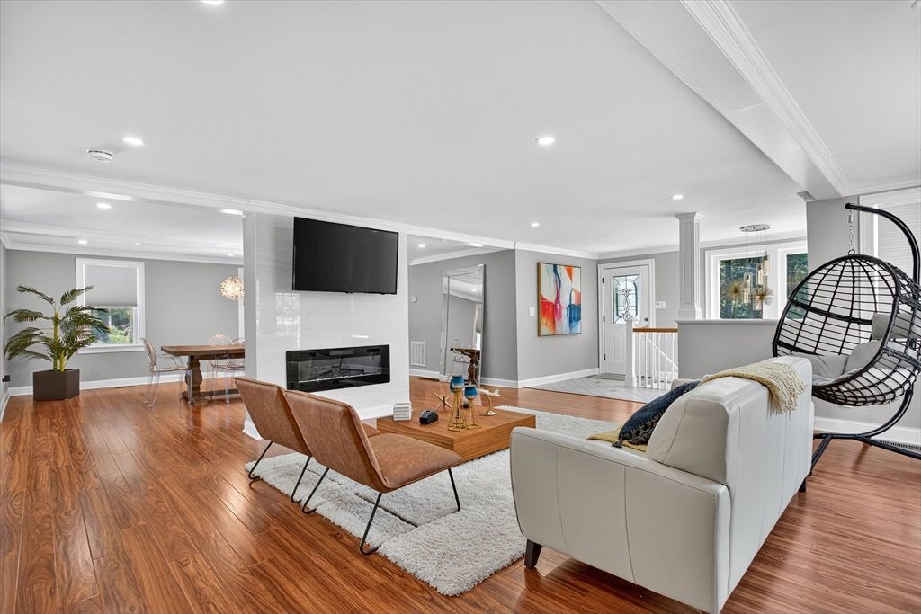 Dining room, Fireplace, Interior, Living room, Recessed Lighting, Wood Texture Flooring