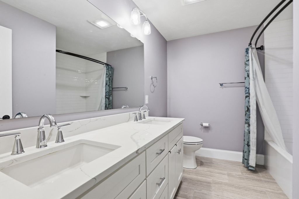 Bathroom, Dual Sink Vanities, Glass Shower, Interior, Recessed Lighting, Wood Texture Flooring
