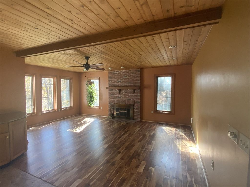Empty room, Fireplace, Interior, Recessed Lighting, Stone Walls, Wooden Beams, Wooden Ceilings, Wood Texture Flooring