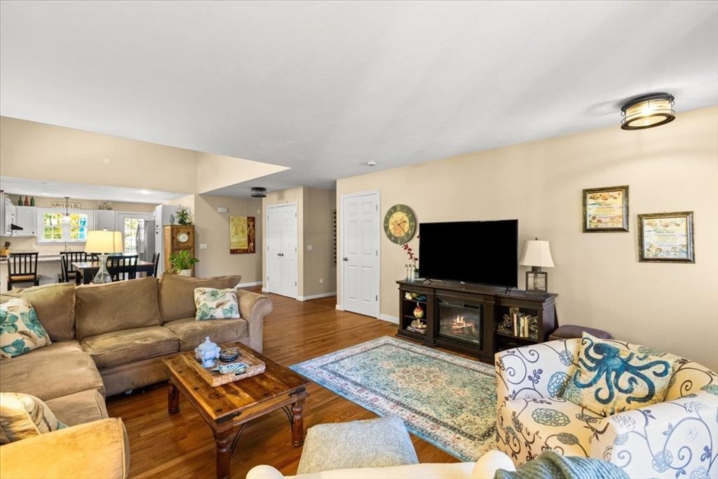 Dining room, Fireplace, Interior, Living room, Recessed Lighting, Wood Texture Flooring