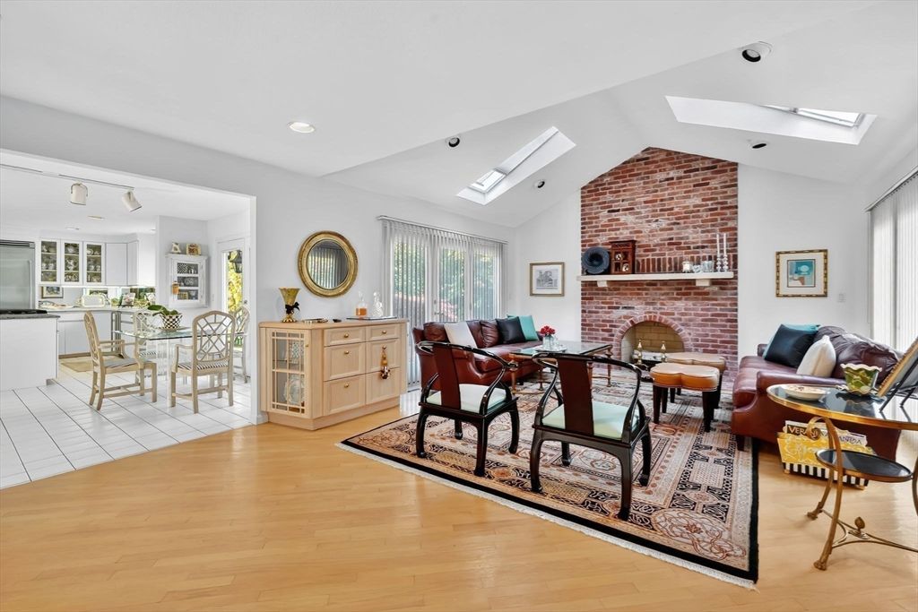 Dining room, Fireplace, Interior, Living room, Recessed Lighting, Stone Walls, Wood Texture Flooring