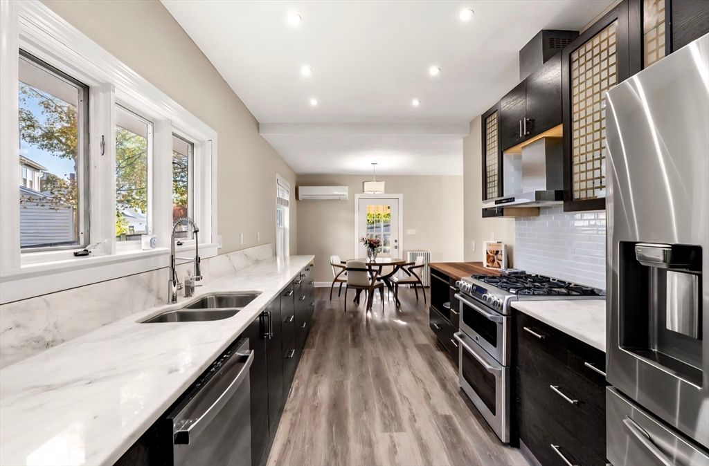 Dining room, Interior, Kitchen, Pendant Lights, Recessed Lighting, Stainless Steel Appliances, Wood Texture Flooring