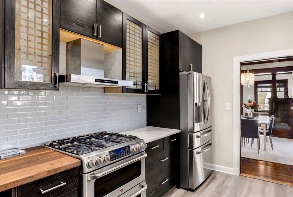Chandelier, Dining room, Interior, Kitchen, Recessed Lighting, Stainless Steel Appliances, Wood Texture Flooring