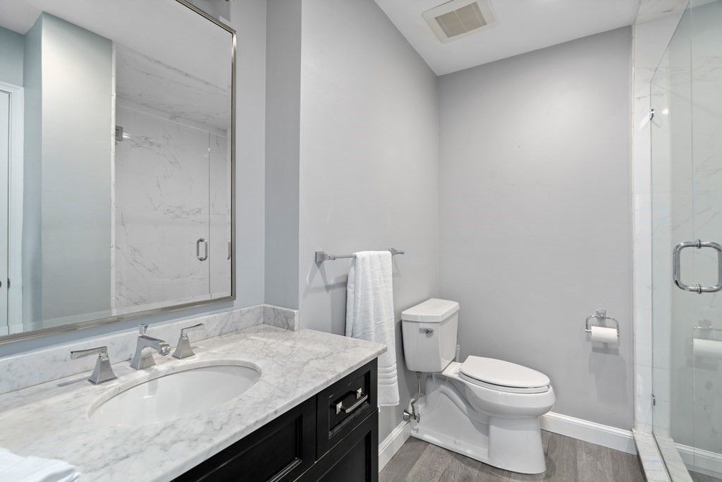 Bathroom, Glass Shower, Interior, Marble Walls, Recessed Lighting, Wood Texture Flooring