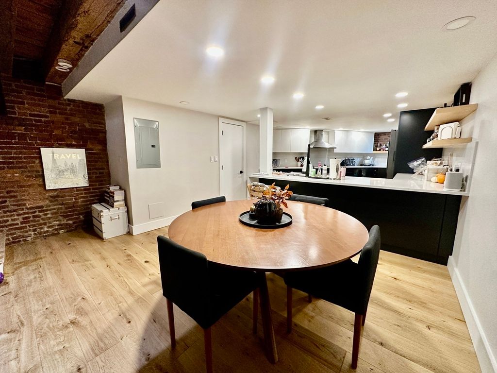 Dining room, Interior, Kitchen, Recessed Lighting, Stainless Steel Appliances, Stone Walls, Wood Texture Flooring