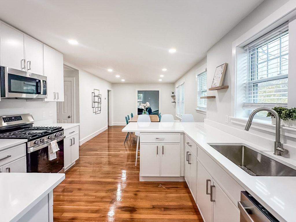 Dining room, Interior, Kitchen, Recessed Lighting, Stainless Steel Appliances, Wood Texture Flooring