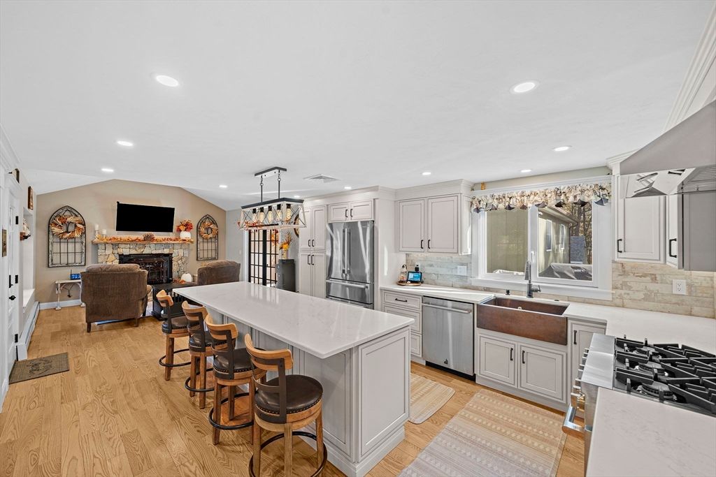 Fireplace, Interior, Kitchen, Living room, Pendant Lights, Recessed Lighting, Stainless Steel Appliances, Wood Texture Flooring