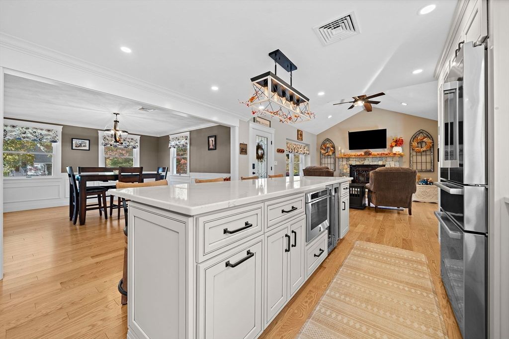 Chandelier, Dining room, Fireplace, Interior, Kitchen, Living room, Pendant Lights, Recessed Lighting, Wood Texture Flooring