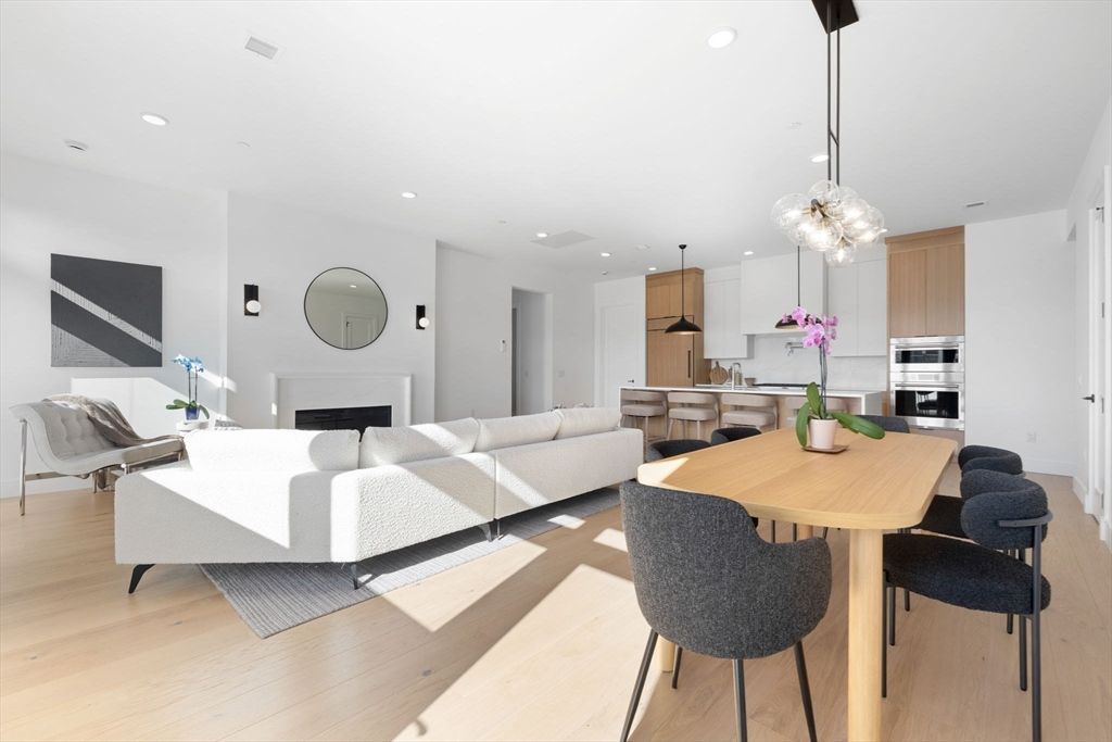 Dining room, Fireplace, Interior, Kitchen, Living room, Pendant Lights, Recessed Lighting, Stainless Steel Appliances, Wood Texture Flooring