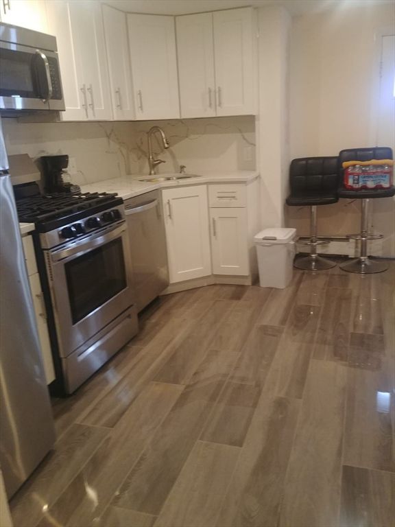 Interior, Kitchen, Marble Walls, Stainless Steel Appliances, Wood Texture Flooring