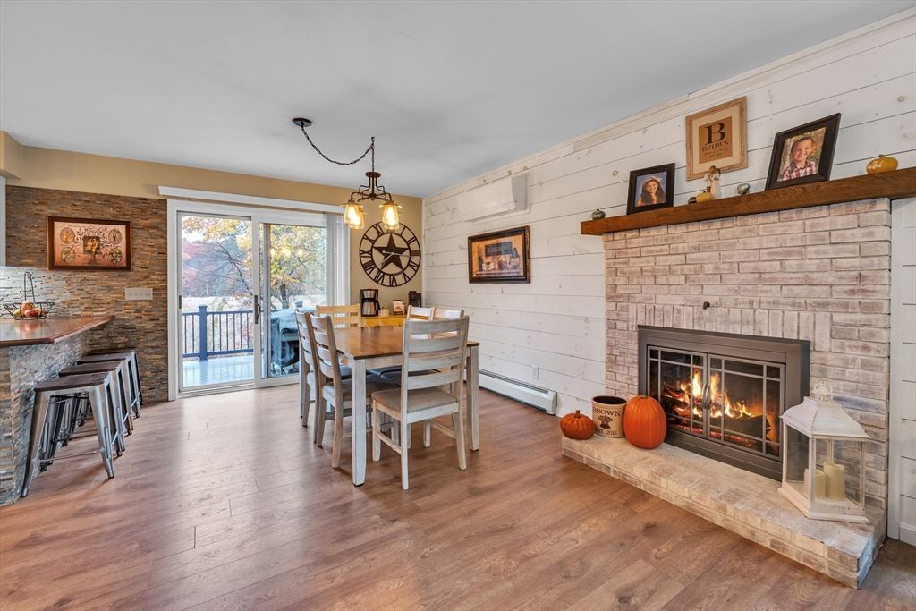 Dining room, Fireplace, Interior, Pendant Lights, Stone Walls, Wood Texture Flooring