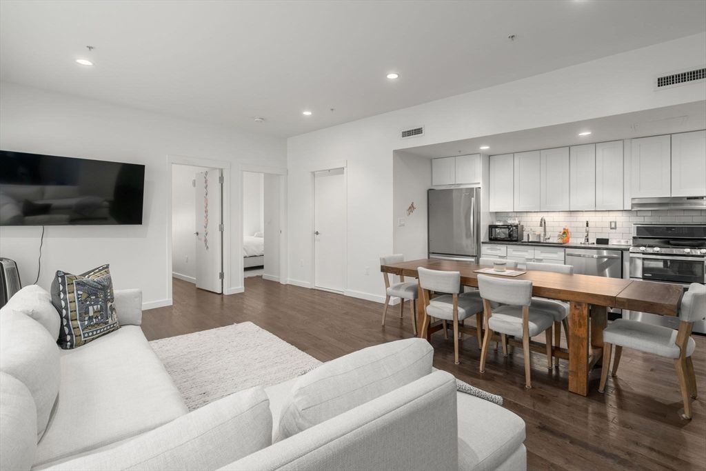 Dining room, Interior, Kitchen, Living room, Recessed Lighting, Stainless Steel Appliances, Wood Texture Flooring