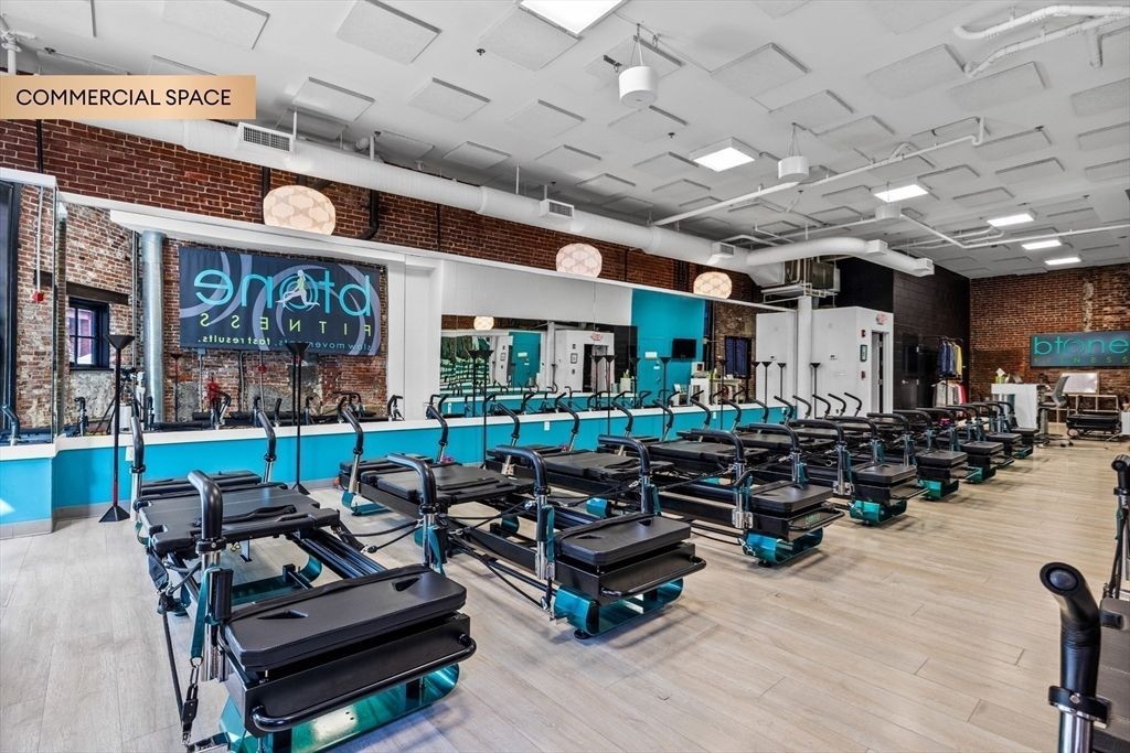 Fitness Equipment, Gym, Interior, Recessed Lighting, Stone Walls, Wood Texture Flooring