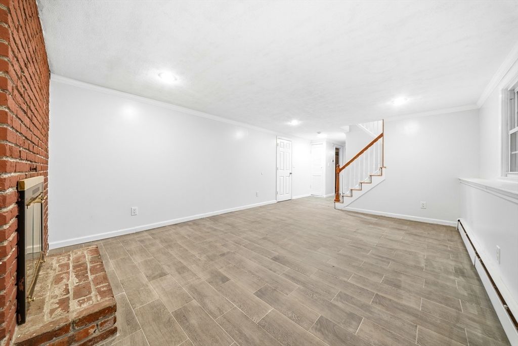 Empty room, Fireplace, Interior, Recessed Lighting, Stone Walls, Wood Texture Flooring