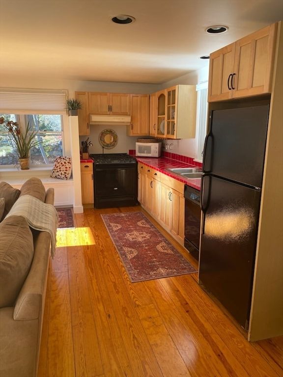 Interior, Kitchen, Recessed Lighting, Tile Countertops, Wood Texture Flooring