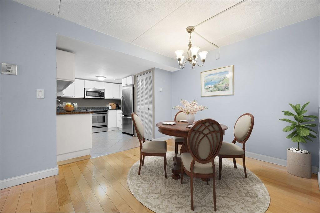 Chandelier, Dining room, Interior, Kitchen, Stainless Steel Appliances, Wood Texture Flooring