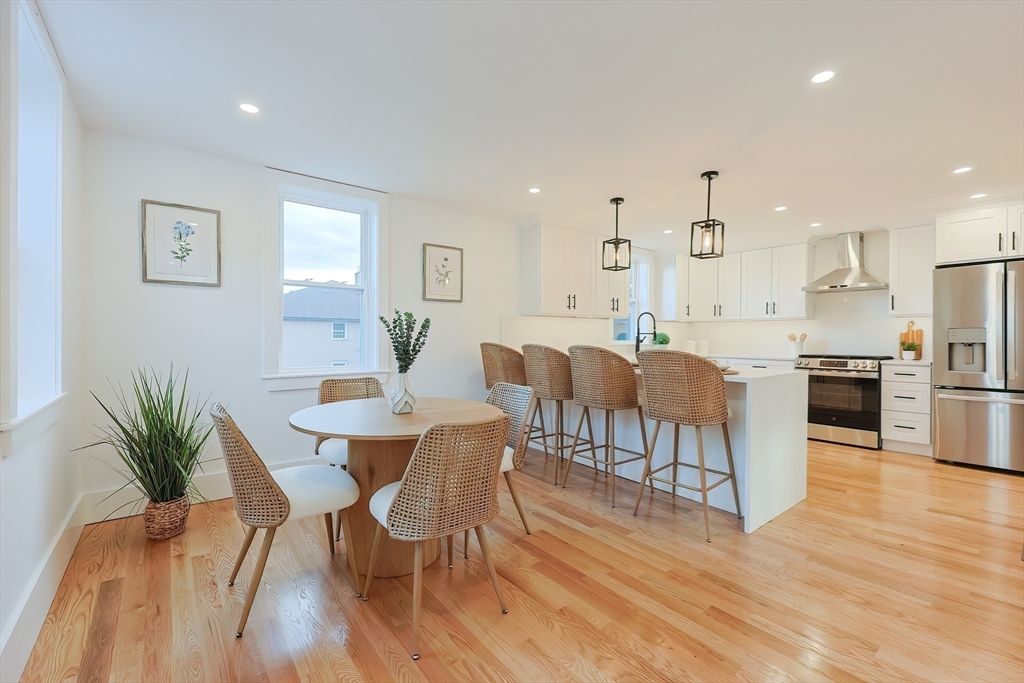 Dining room, Interior, Kitchen, Pendant Lights, Recessed Lighting, Stainless Steel Appliances, Wood Texture Flooring
