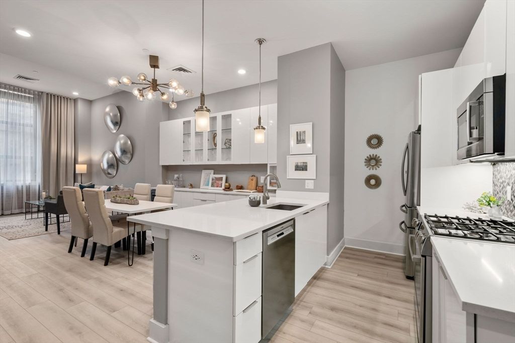 Dining room, Interior, Kitchen, Pendant Lights, Recessed Lighting, Stainless Steel Appliances, Wood Texture Flooring