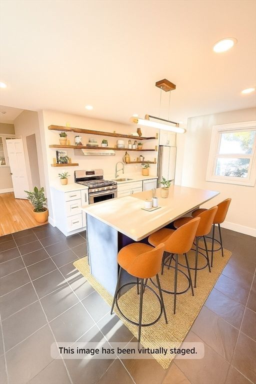 Dining room, Interior, Kitchen, Pendant Lights, Recessed Lighting, Stainless Steel Appliances, Wood Texture Flooring