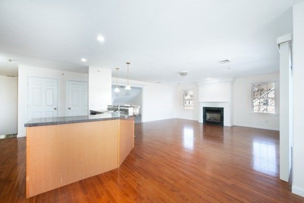 Empty room, Fireplace, Interior, Kitchen, Pendant Lights, Recessed Lighting, Wood Texture Flooring