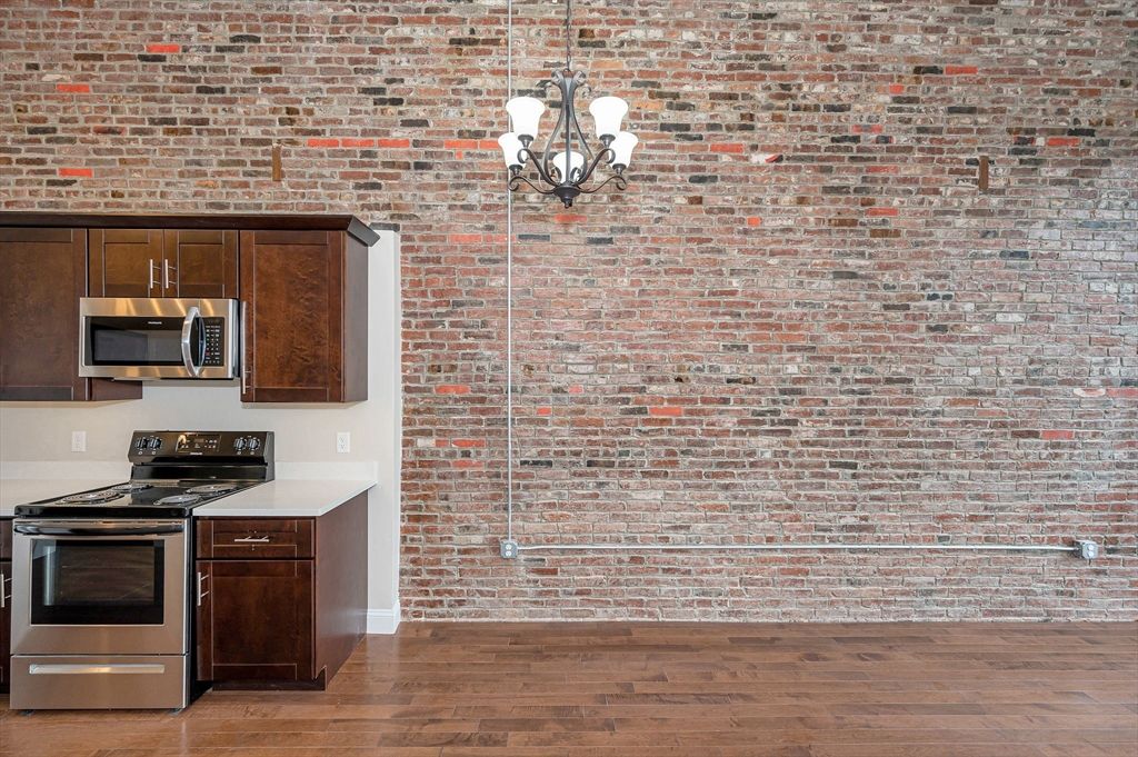 Interior, Kitchen, Pendant Lights, Stainless Steel Appliances, Stone Walls, Wood Texture Flooring