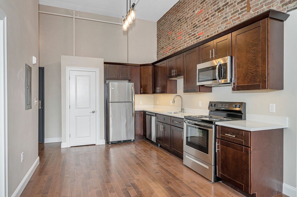 Interior, Kitchen, Pendant Lights, Stainless Steel Appliances, Stone Walls, Wood Texture Flooring