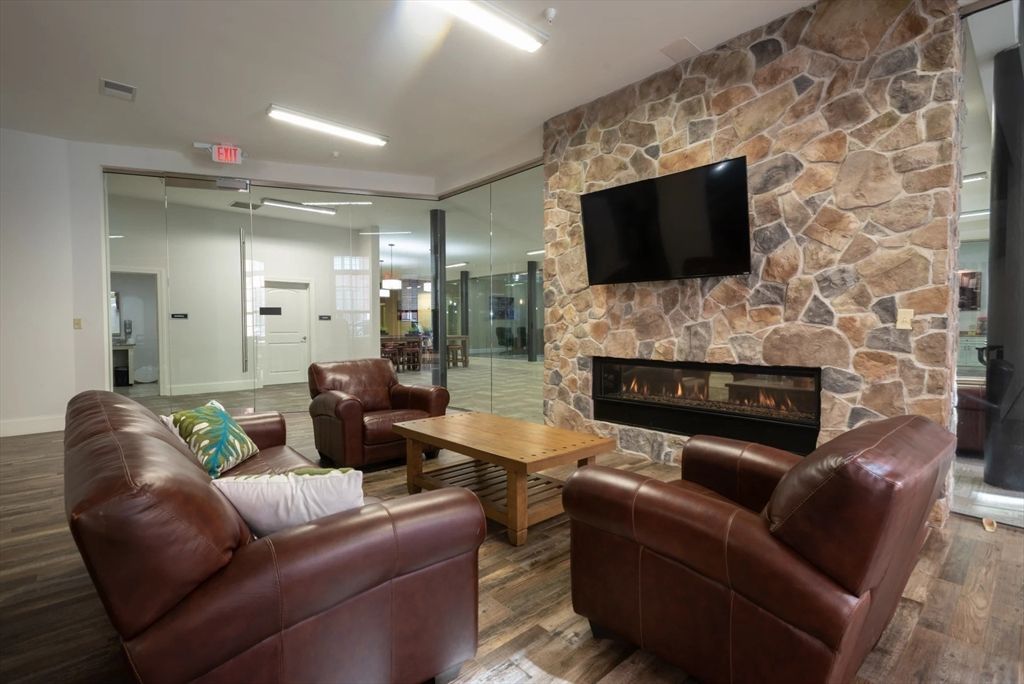 Fireplace, Interior, Living room, Recessed Lighting, Stone Walls, Wood Texture Flooring