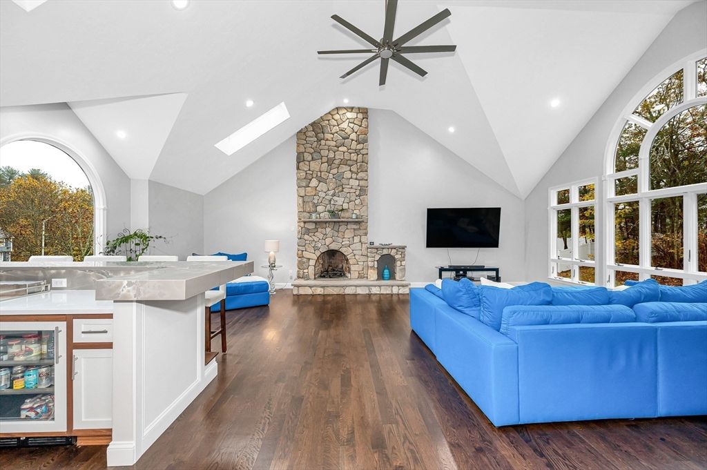 Fireplace, Interior, Living room, Recessed Lighting, Stone Walls, Wood Texture Flooring