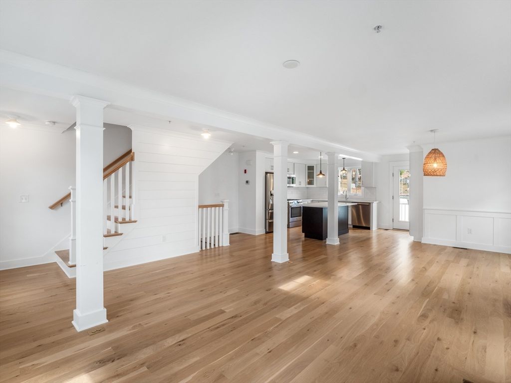 Empty room, Interior, Kitchen, Pendant Lights, Stainless Steel Appliances, Wood Texture Flooring